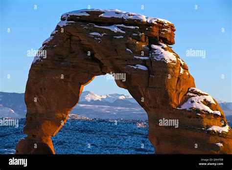 Detailed view of Delicate Arch with snow in winter at sunset, Arches ...