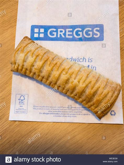 A Greggs, vegan-friendly, sausage roll sitting on top of some Greggs packaging Stock Photo ...