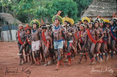 Kayapo men and women ritual dancing. To be able to dance during festivals, many women use the ...