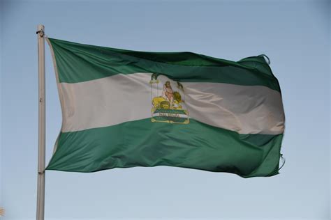 Andalusian flag with a blue sky 16732647 Stock Photo at Vecteezy