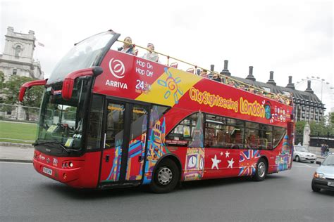 The Original London Bus Company with tourists and a guide at various ...