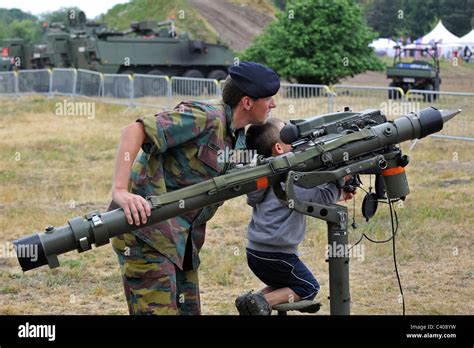 Soldier showing Mistral Air Defence Missile System to child during open day of the Belgian army ...