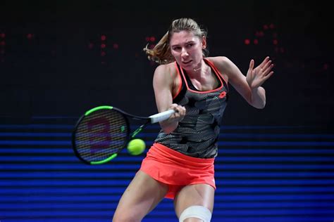 Russia's Ekaterina Alexandrova returns the ball to Belgium's Alison ...