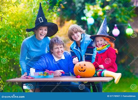 Family Carving Pumpkin at Halloween Stock Image - Image of caucasian, october: 57178907