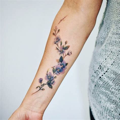 Small Tattoos for arm | Flower wrist tattoos, Vine tattoos, Purple flower tattoos