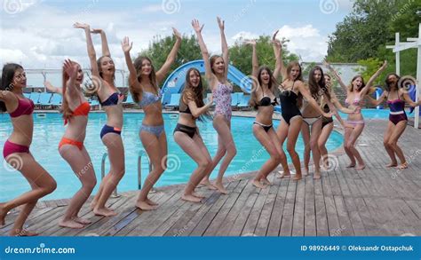 Pool Party, Slender Girls in Bathing Suits Jumping Near Swimming Pool ...