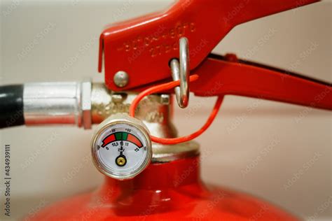 Pressure gauge on the fire extinguisher. Stock Photo | Adobe Stock