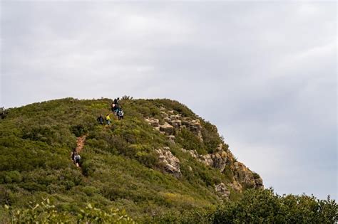 Premium Photo | The trail is steep and steep, with a few people ...