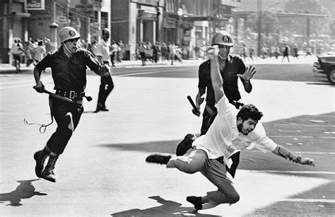 A protester against brazilian dictatorship being pursued by police, 1964. | Dictatorship ...