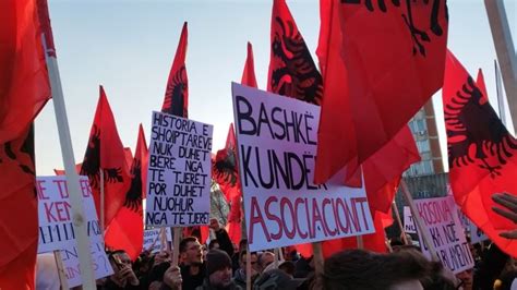 With red and black flags, students in Kosovo protest against the ...