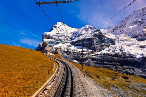 Jungfrau Railway train climbing from Kleine Scheidegg to Eigergletscher, Swiss Alps, Canton Bern ...