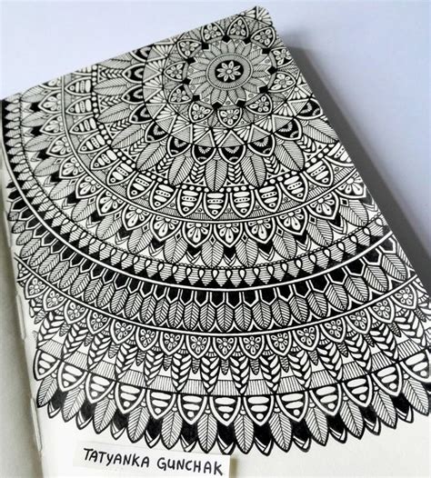 a book with black and white designs on it