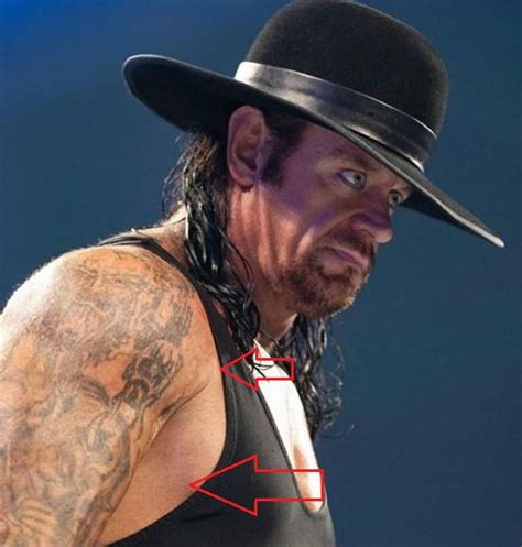 Undertaker's 4 Tattoos & Their Meanings - Body Art Guru