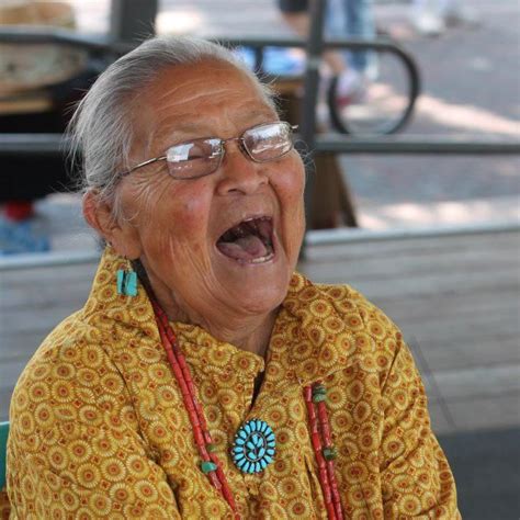 an old woman with glasses making a surprised face