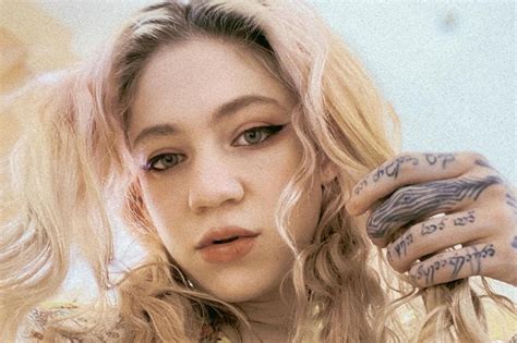 What do Grimes' tattoos mean? | The US Sun