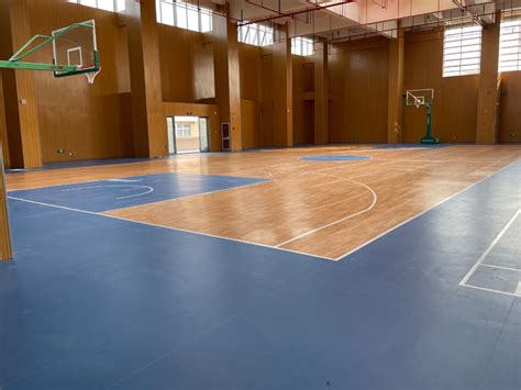 What kind of floor material is usually used for a basketball court ...