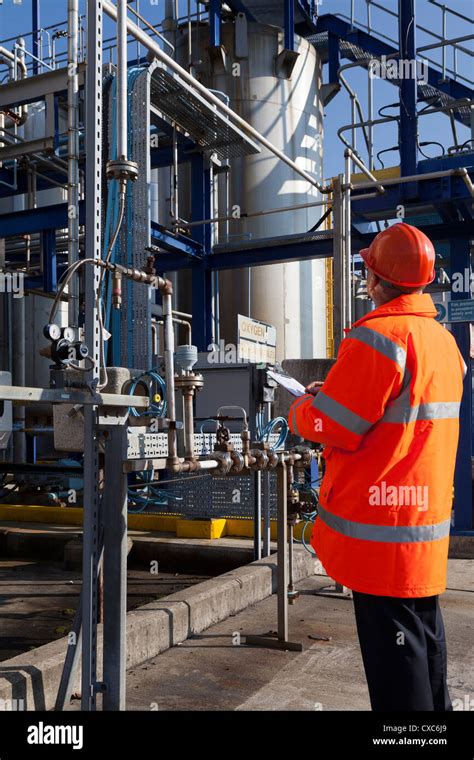 chemical plant process operator worker checking safety check protective ...