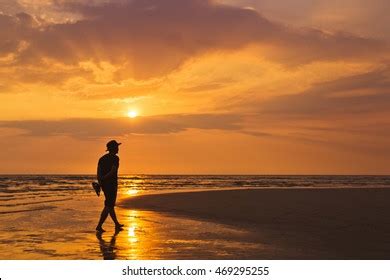 Man Walking Along Beach Sunset Stock Photo 469295255 | Shutterstock