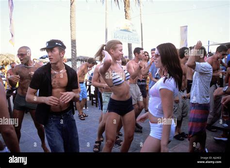 Young people dancing at Bora Bora beach party at Playa d'en Bossa ...