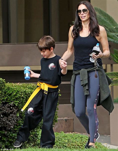 Erica Packer shows off slender figure in exercise attire as she steps out with son Jackson ...