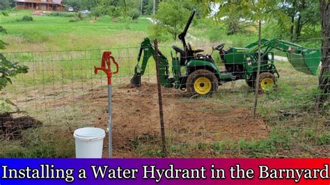 Installing a Water Hydrant in the Barn Yard with a John Deere 2025 - YouTube