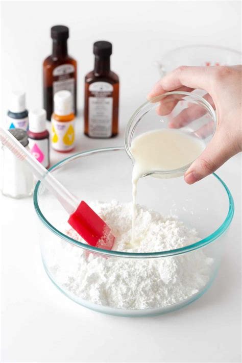 Pouring milk into bowl of powdered sugar to make powdered sugar icing for cookies | Powdered ...