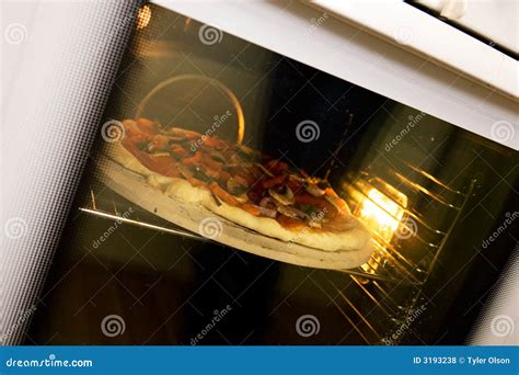 Pizza Baking in Oven stock photo. Image of dinner, italian - 3193238