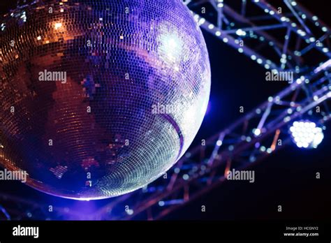 Blue lit disco ball party concept Stock Photo - Alamy