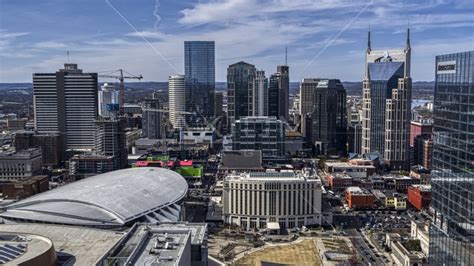 The city's skyline behind arena and hotel, Downtown Nashville ...