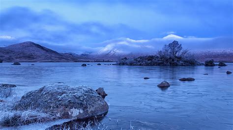 Landscape photography of mountain range in front of body of water during snow season HD ...