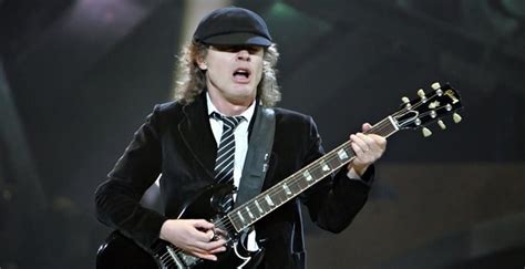 Angus Young Biography - Facts, Childhood, Family Life & Achievements