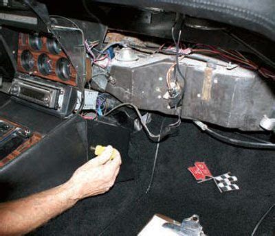 the inside of a car that is being worked on with some wires and other items