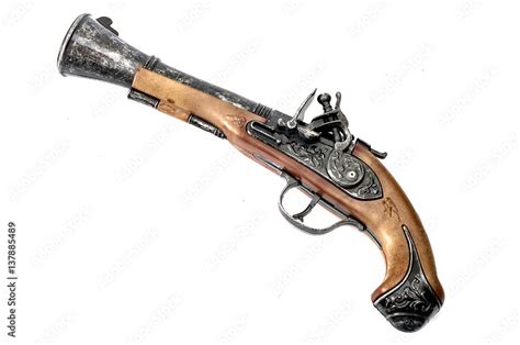 Replica of an antique flintlock, an old colonial era and pirate pistol similar to a musket but ...