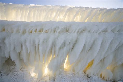 Bizarre ice formations engulf frozen lighthouse in Michigan, in pictures