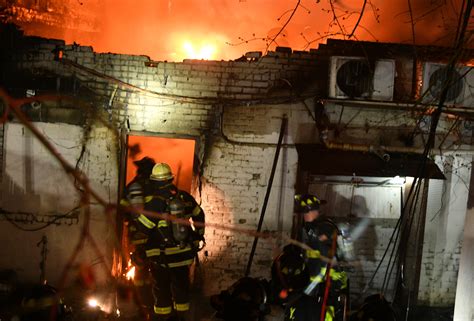 Two firefighters seriously injured after being caught in collapse of burning Queens building ...