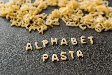 Raw Alphabet Pasta is Written with Letters on Granit Grey Surface. Stock Image - Image of ...