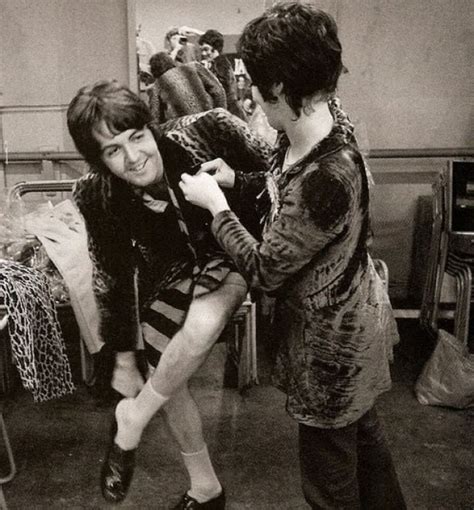 Francie Schwartz helps Paul McCartney on with a stage costume. 1968. | Paul mccartney, Beatles ...