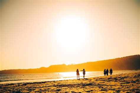 friends walking on the beach 4594873 Stock Photo at Vecteezy