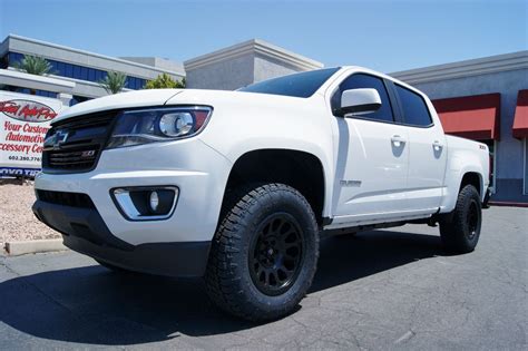 a white truck parked in front of a building