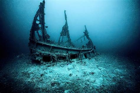 Premium Photo | Diver underwater view of the mysterious wreckage of an ...