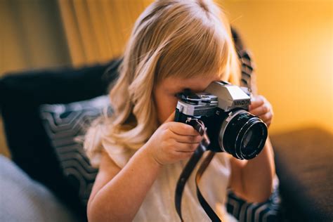 Free photo: Shallow Focus Photography of Girl Holding a Black and Silver Dslr Camera - Blurred ...