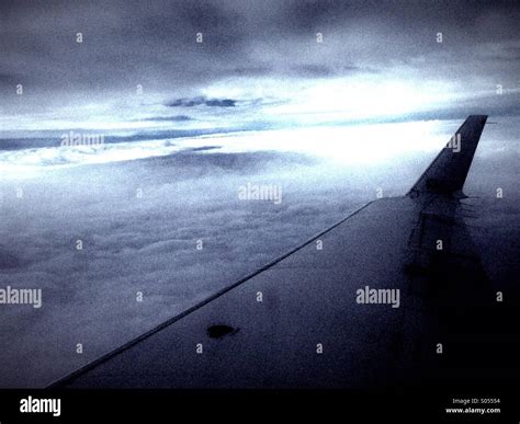 Airplane wing, storm Stock Photo - Alamy