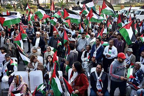 Activists of Civil Society holding Palestine Flags and placards during ...