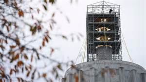 See photos as tarp comes down on Gold Man at Oregon State Capitol