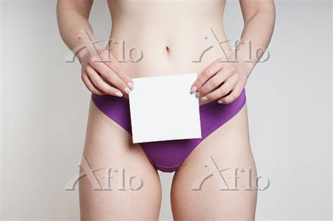 Woman In Panties Holding Blank Piece Of Paper With Copy Space