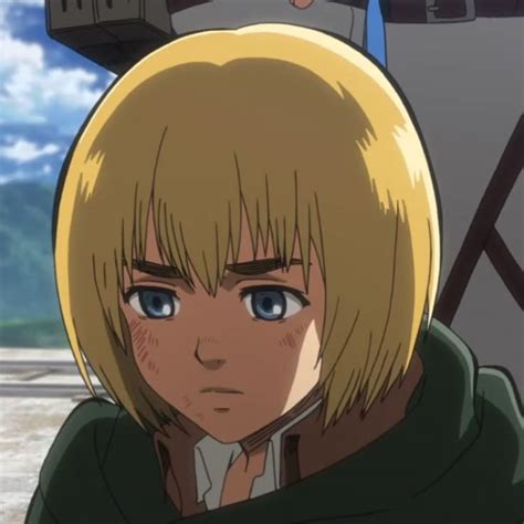 An Anime Character With Blonde Hair And Blue Eyes Looks At The Camera