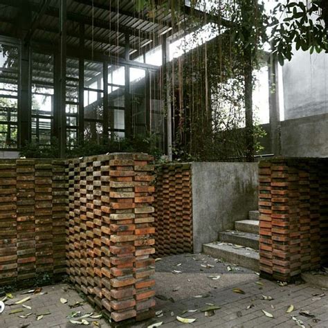 An Outdoor Area With Brick Walls And Stairs