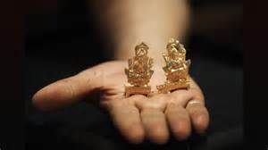 gold futures drop  west asia uncertainty rediff moneynews
