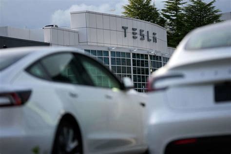 tesla profit falls  spending rises  meet musks goals  ai robots
