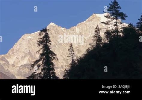 Aerial View Of Towering Snow Covered Mount Everest Rising Above Dark